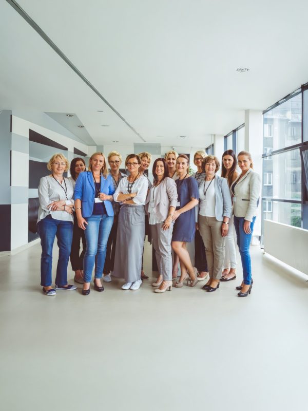 ladies Portrait of large group of happy woman during conference, smiling at the camera.